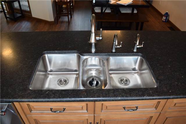 Oversize stainless undermount sink - honed granite countertop